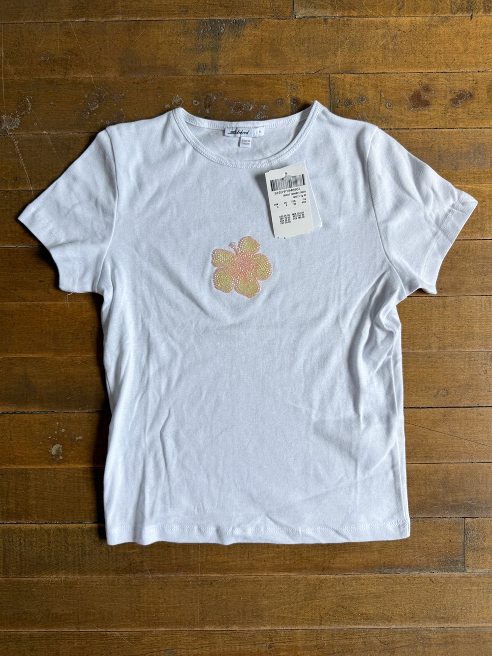 Subdued tropical beaded tee